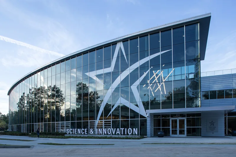 Corporate photography session at modern glass-facade Science & Innovation building exterior