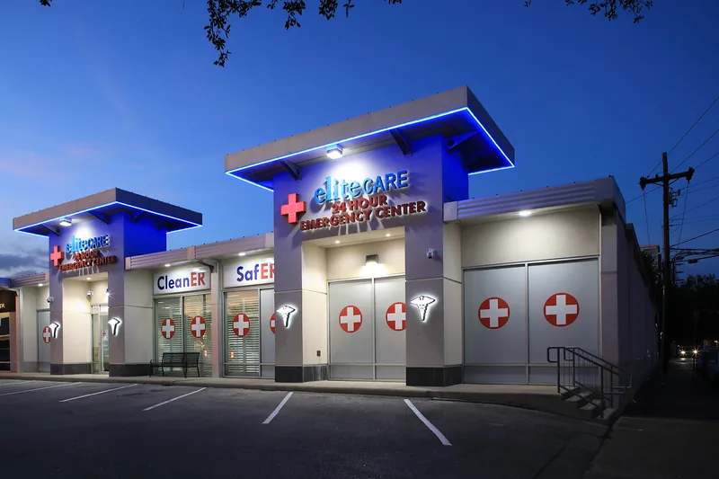 EliteCare 24-hour center exteriors with glowing blue LED canopy and stucco facade