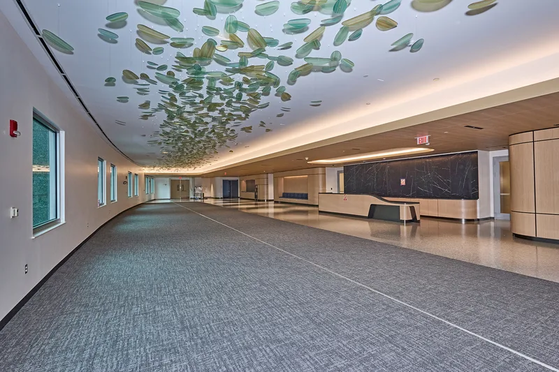 Duncan Building lobby interior with suspended glass leaf ceiling art installation
