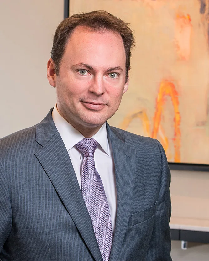Male executive corporate headshot gray suit purple tie professional portrait