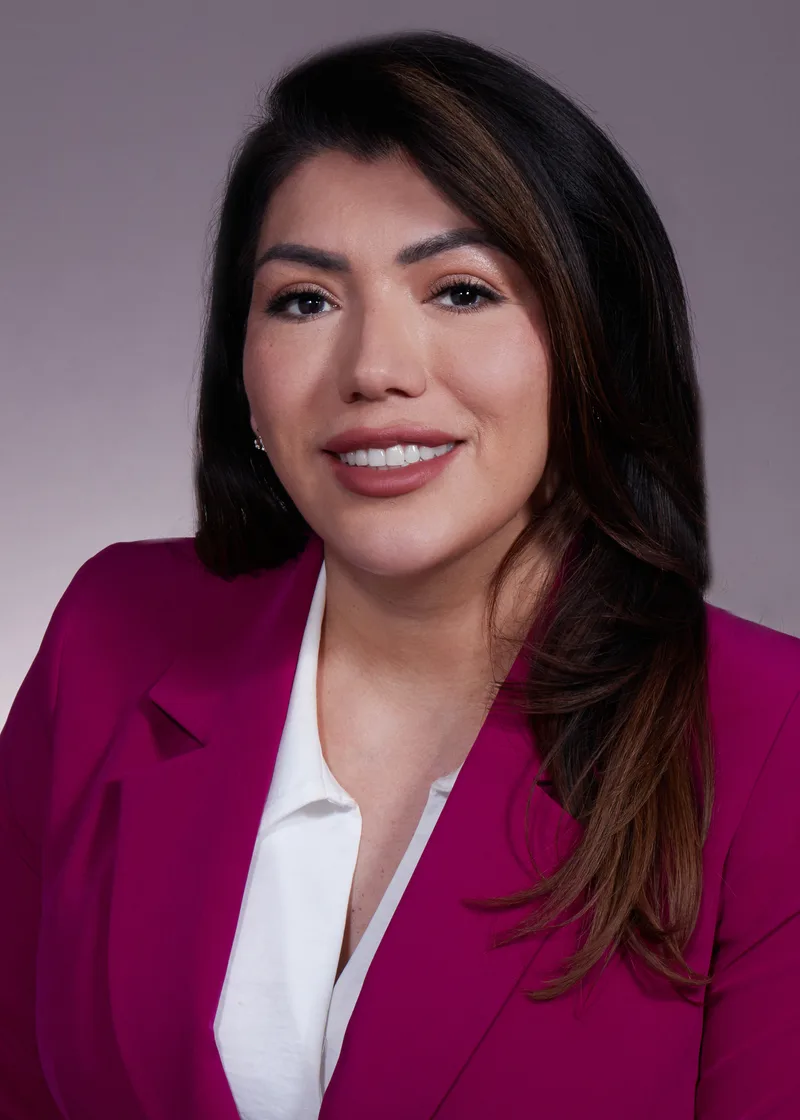 Aviso Elva professional headshot magenta blazer white blouse studio background