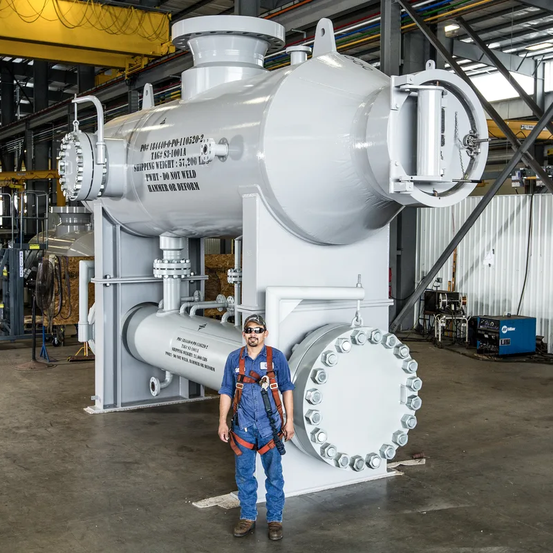 Pressure vessel human scale reference gray steel worker safety harness fabrication