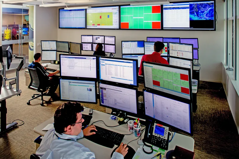 environmental portrait photography multi-monitor industrial control room operators wall displays